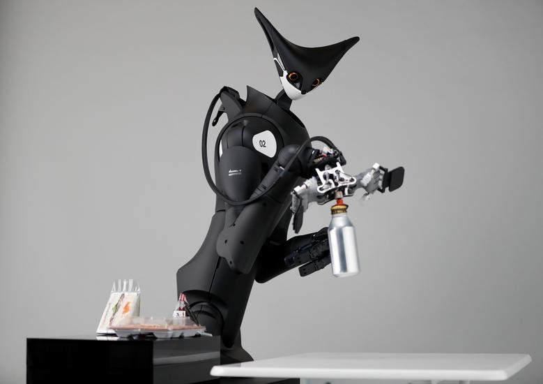 Telexistence's shelf-stacking avatar robot, designed to resemble a kangaroo and developed to work in a convenience store, is demonstrated during a photo opportunity ahead of its unveiling in Tokyo.  REUTERS/Issei Kato